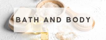 Bath and Body essentials including brushes, oils, and bath salts arranged on a white background for a spa like experience.