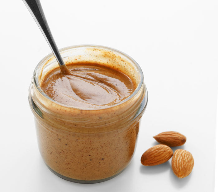 Almond butter with a spoon