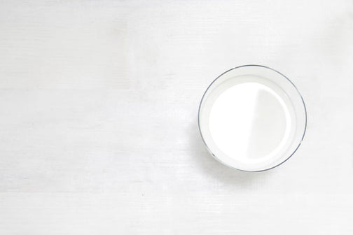 Glass of creamy powdered coconut milk