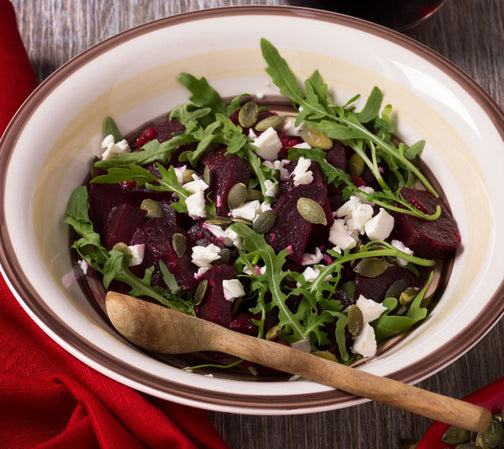 Organic pumpkin seeds on salad