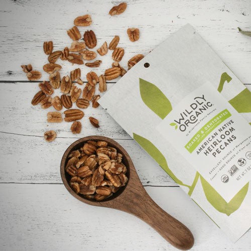 Raw pecans in measuring cup